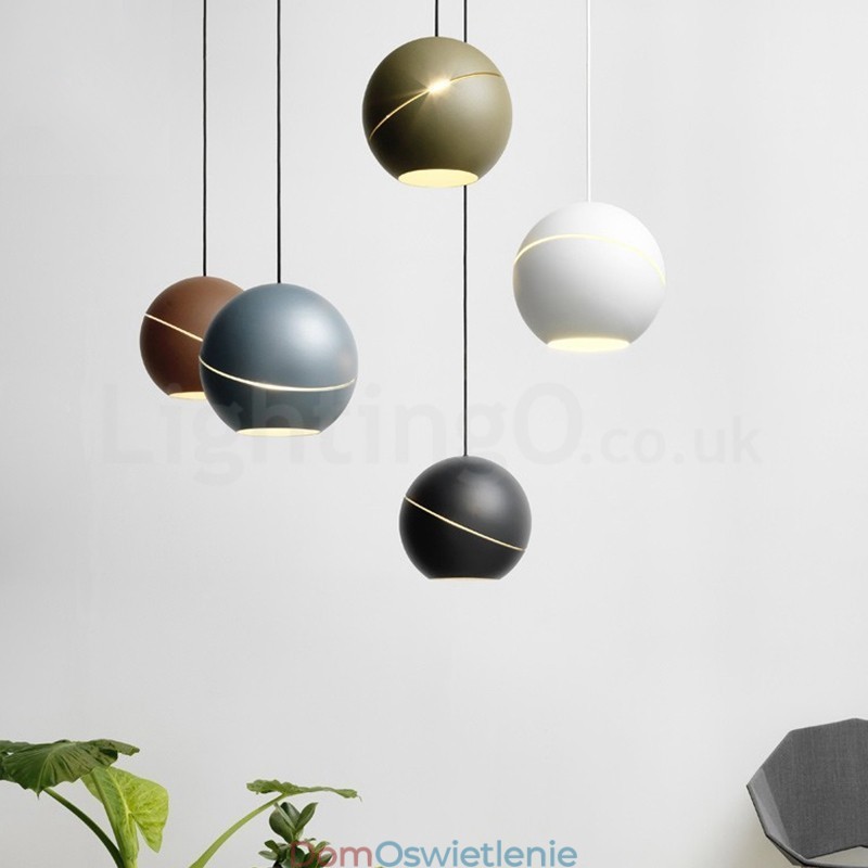 Nowoczesna lampa wisząca przy łóżku w kształcie kuli