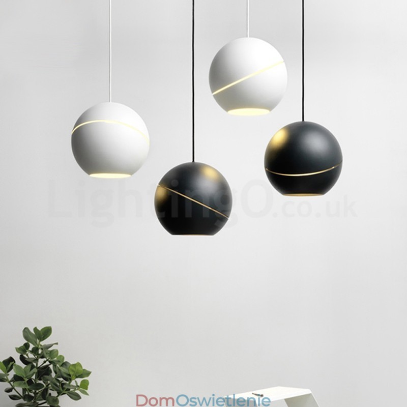 Nowoczesna lampa wisząca przy łóżku w kształcie kuli